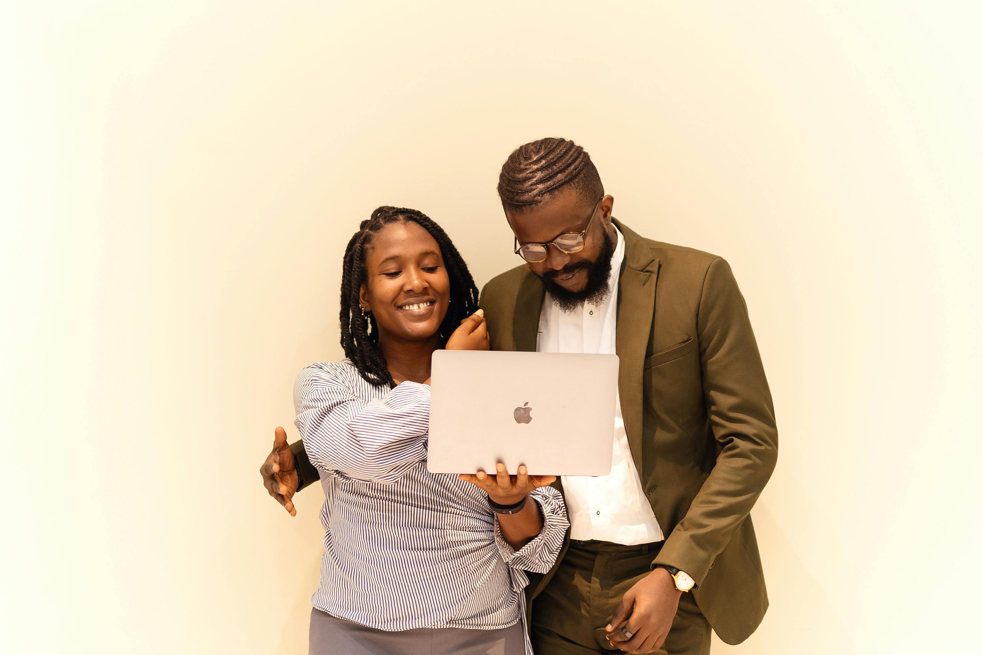 Professionals in Lagos collaborating together around a laptop