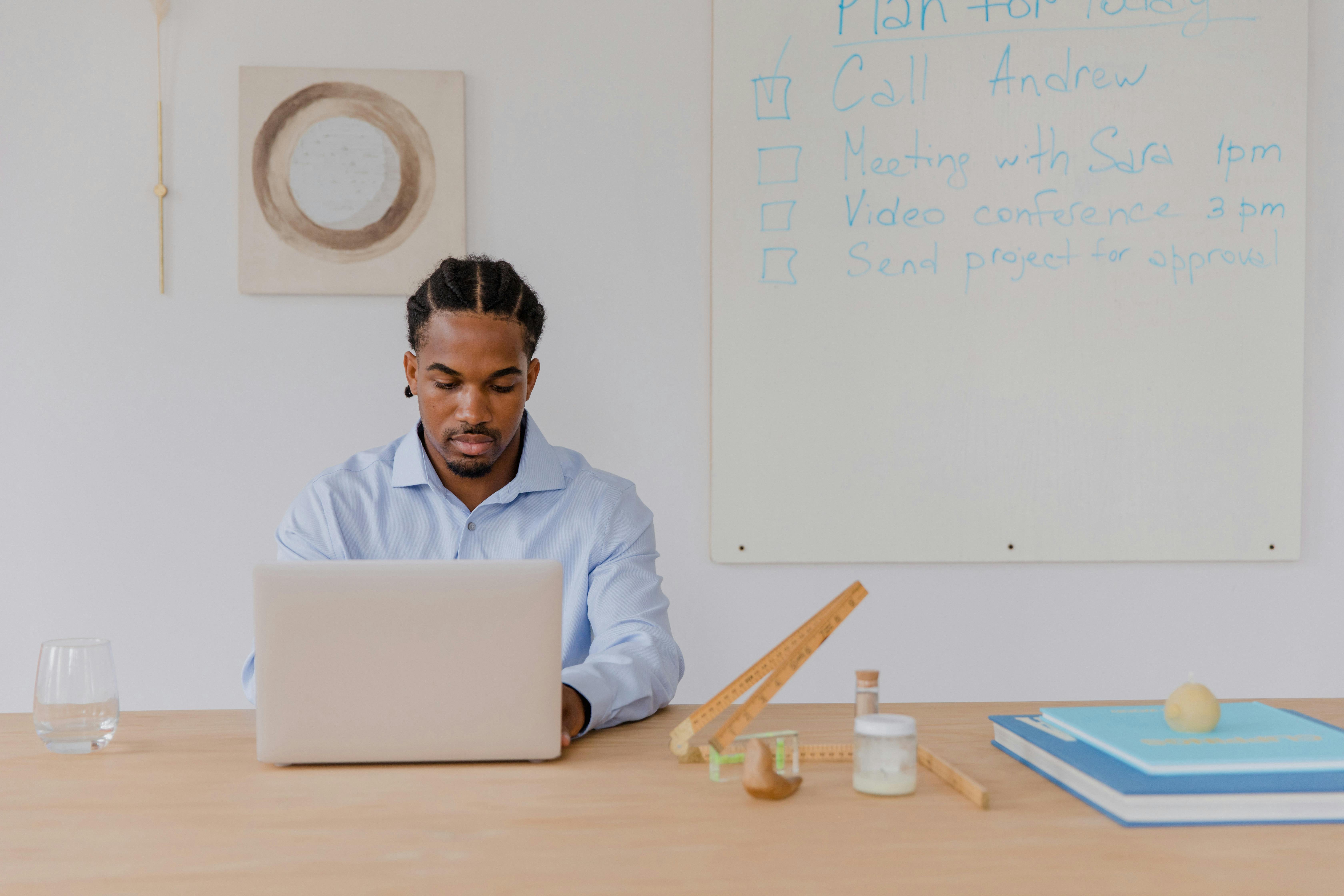 Professional planning tasks on a laptop in a bright workspace
